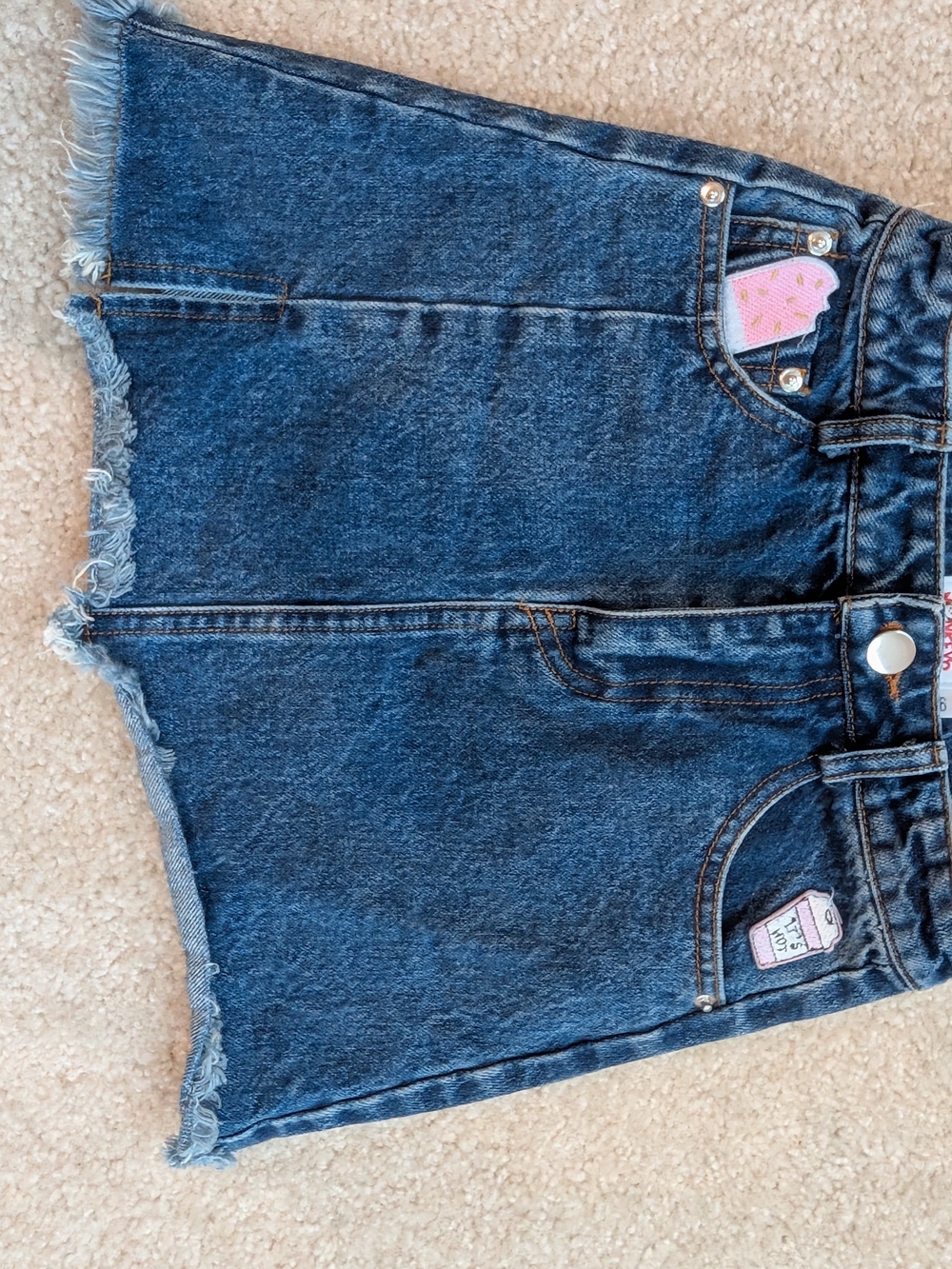 Dark Wash Denim Mini Skirt with Frayed Hem & Cute Patch Details